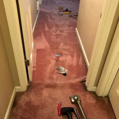 Carpet stretching hallway with professional tools
